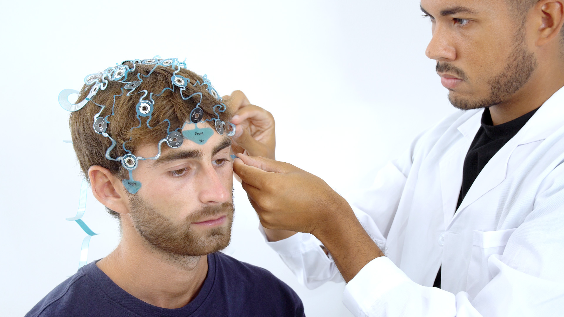 Patient undergoing an electroencephalogram (EEG) to record brain activity.